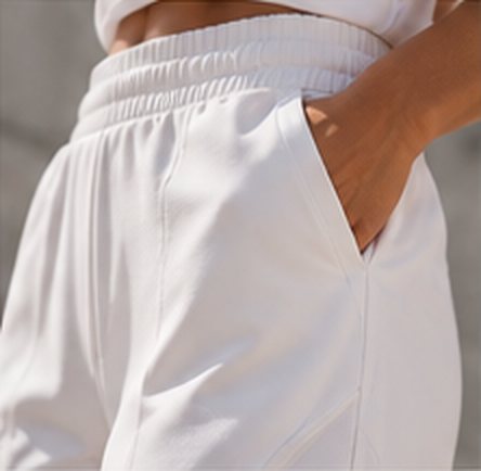 Hand in the hidden pocket of the wide-leg pant